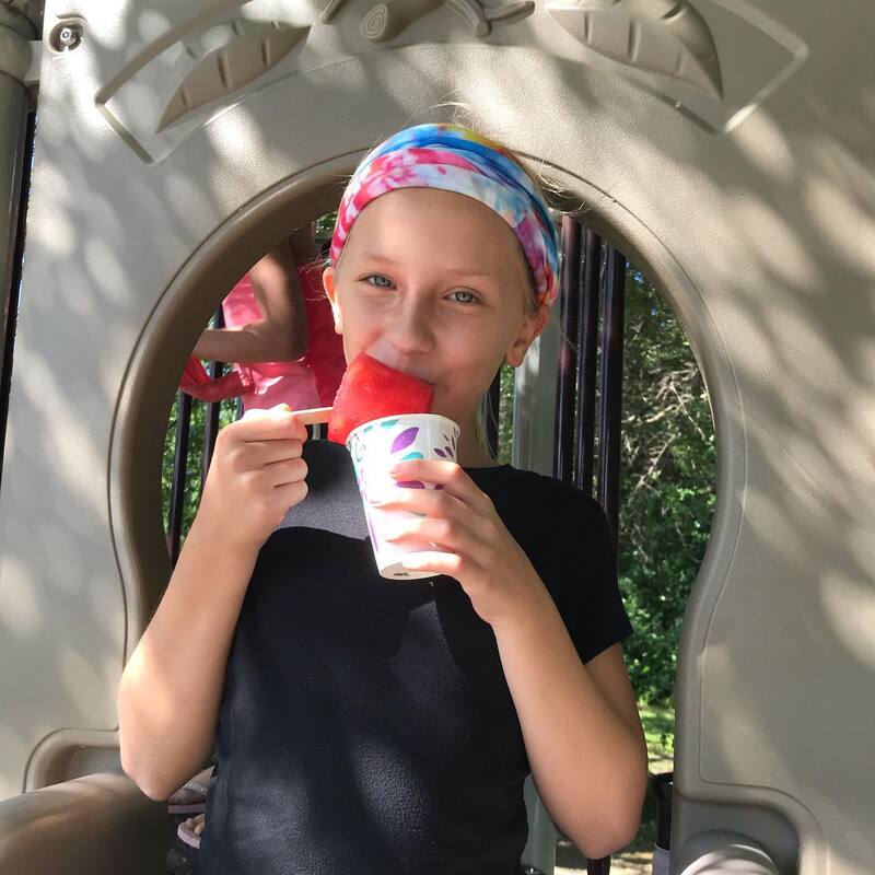 child enjoying icee at summer camp