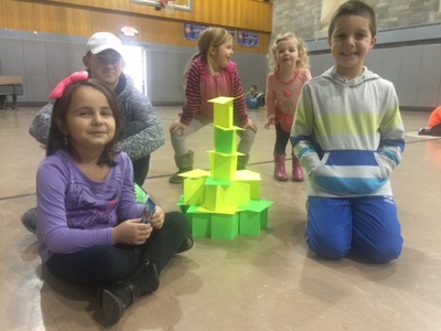 kids show off structure during camp