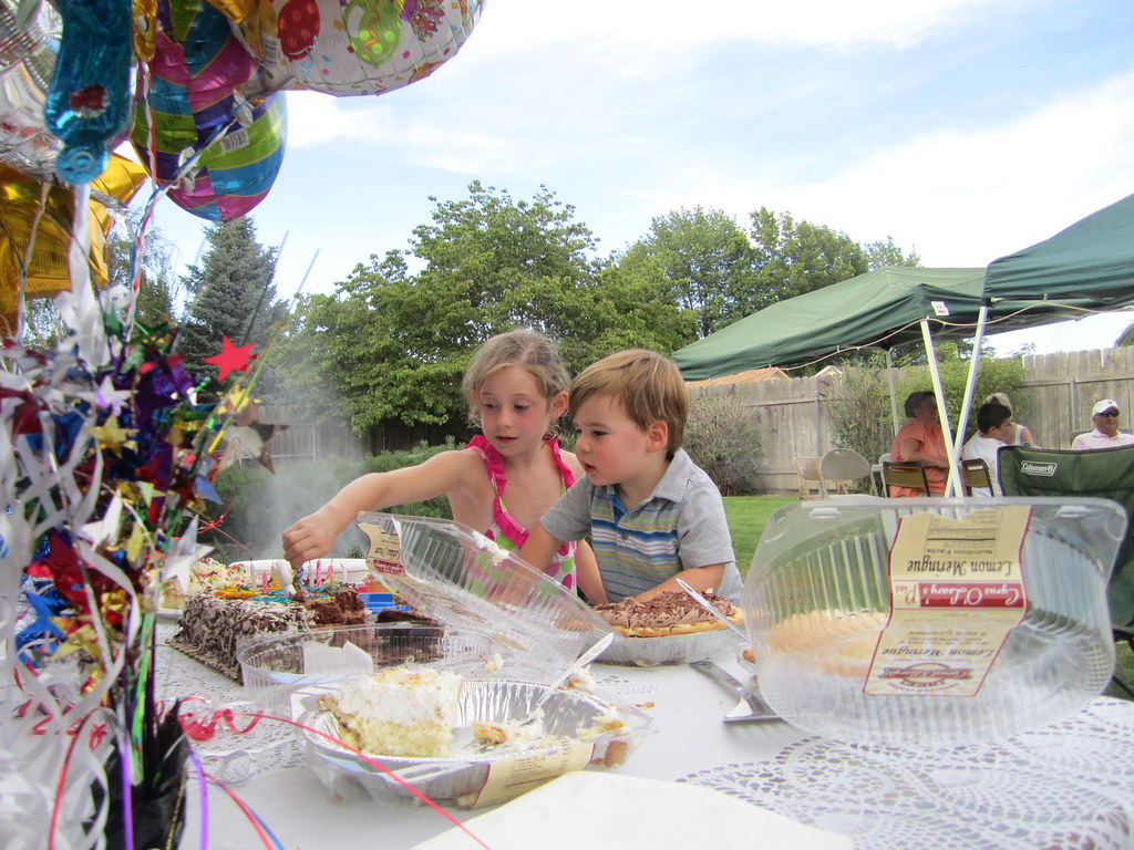 kids enjoying desserts at outdoor Summer party
