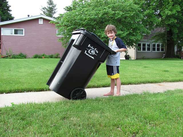 kid doing chore - taking out the trash