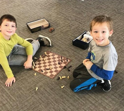 kids playing chess during after school program