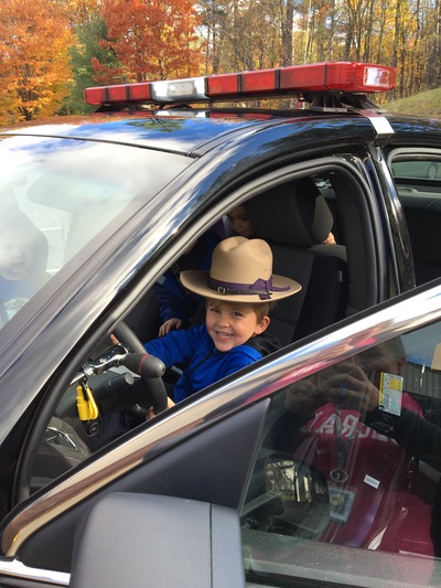 day care child behind the wheel of cop car