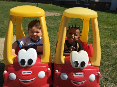 2 day care friends riding cars