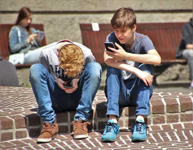 teens playing on phones
