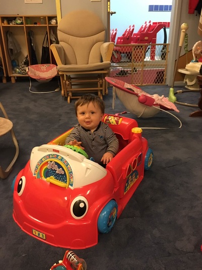 day care child riding toy car