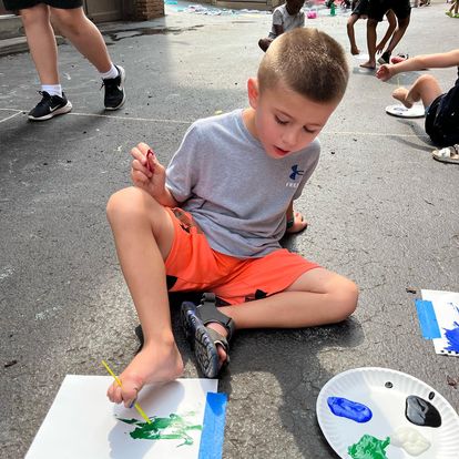 camper painting with feet